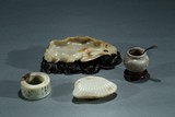 A SET OF FOUR JADE SCHOLAR OBJECTS