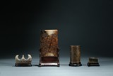A SET OF FOUR JADE SCHOLAR OBJECTS