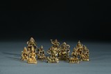 A GROUP OF TEN SMALL GILT BRONZE BODHISATTVA