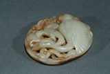 A WHITE JADE ROUND PENDANT