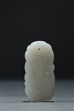 A WHITE JADE 'WUHUA' PENDANT