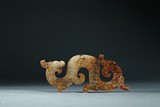 AN ARCHAIC JADE 'DRAGON' ORNAMENT