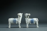 A PAIR OF WHITE AND BLUE GLAZE HORSES