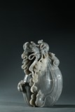 A GREY JADE CARVING OF COIN BAG