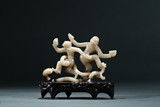 A JADE OPENWORK CARVING OF 'DANCING FIGURES' 
