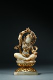 A WHITE JADE GOLD-INLAID BODHISATTVA