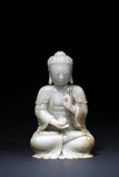 A WHITE JADE CARVED FIGURE OF BODHISATTVA
