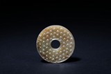 AN ARCHAIC JADE DISK BI