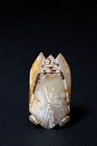 AN ARCHAIC WHITE AND RUSSET JADE CICADA
