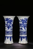 A PAIR OF WHITE AND BLUE 'FIGURE' BEAKER VASE