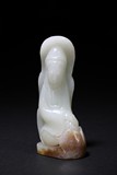 A SMALL WHITE JADE CARVING OF GUANYIN