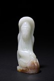 A SMALL WHITE JADE CARVING OF GUANYIN