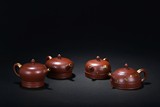 ZHOU GUIZHEN: SET OF FOUR ZISHA TEAPOTS