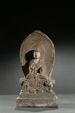 A STONE CARVED POLYCHROMED 'BUDDHIST' STELE