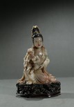 AN SOAPSTONE CARVING OF GUANYIN AND SON