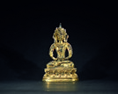 A GILT-BRONZE FIGURE OF AMITAYUS