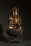 A LARGE GILT BRONZE SHAKYAMUNI ON LOTUS BASE