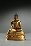 A GILT-BRONZE FIGURE OF AMITABHA