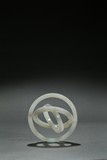 A WHITE JADE CARVED THREE RING ARMILLARY DISC