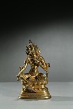 A GILT-BRONZE FIGURE OF GREEN TARA