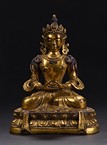 A GILT-BRONZE FIGURE OF AMITAYUS