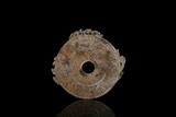 AN ARCHAIC JADE 'MYTHICAL BEASTS' ORNAMENT DISC BI