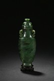 A SPINACH GREEN JADE CARVED HU-FORM VASE WITH COVER