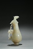 A WHITE JADE 'PHOENIX HEAD' EWER