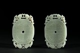 A PAIR OF CELADON JADE PENDANTS