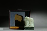 A WHITE JADE 'FIGURES' BOULDER W/ SPINACH GREEN JADE STAND