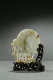 A WHITE JADE CIRCULAR 'GUANYIN' TABLE SCREEN