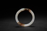 A WHITE JADE 'DRAGON' BANGLE
