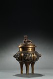 A LARGE PARCEL-GILT TRIPOD CENSER