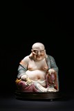 A FAMILLE ROSE FIGURE OF BUDAI