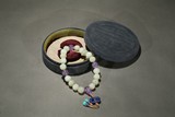 A WHITE JADE AND AMETHYST ROSARY BRACELET