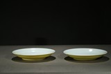 A PAIR OF YELLOW GLAZED INCISED DISHES