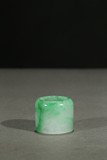 A JADEITE CARVED ARCHER'S RING