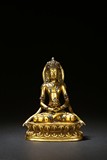 A GILT-BRONZE INLAID AMITAYUS FIGURE