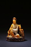 A SHOUSHAN SOAPSTONE SEATED GUANYIN