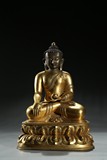 A GILT-BRONZE FIGURE OF SHAKYAMUNI