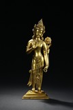 A GILT-BRONZE FIGURE OF STANDING BODHISATTVA