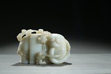 A JADE CARVING OF ELEPHANT AND BOYS