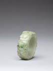 A JADEITE CARVED BANGLE