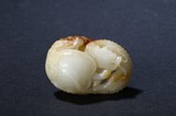 A WHITE AND RUSSET JADE 'DRAGON TURTLE' CARVING
