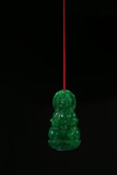 A SPINACH GREEN JADEITE PENDANT