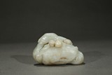 A WHITE JADE 'CRANE AND PEACH' CARVING