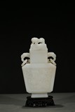 A WHITE JADE CARVED 'BUDDHIST LION' VASE