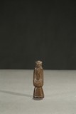 A JADE CARVING OF STANDING FIGURE