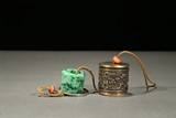 A JADEITE ARCHER'S RING WITH SILVER DRAGON BOX