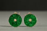 A PAIR OF CIRCULAR JADEITE EAR PENDANTS